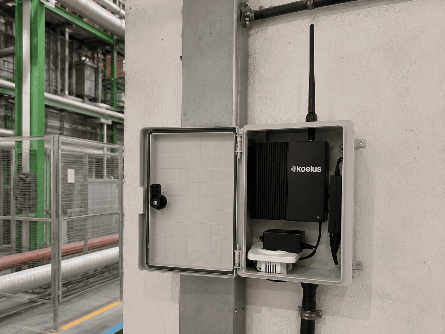 WisGate Connect RAK7391 master gateway installed inside an enclosure at the Madrid industrial facility.
